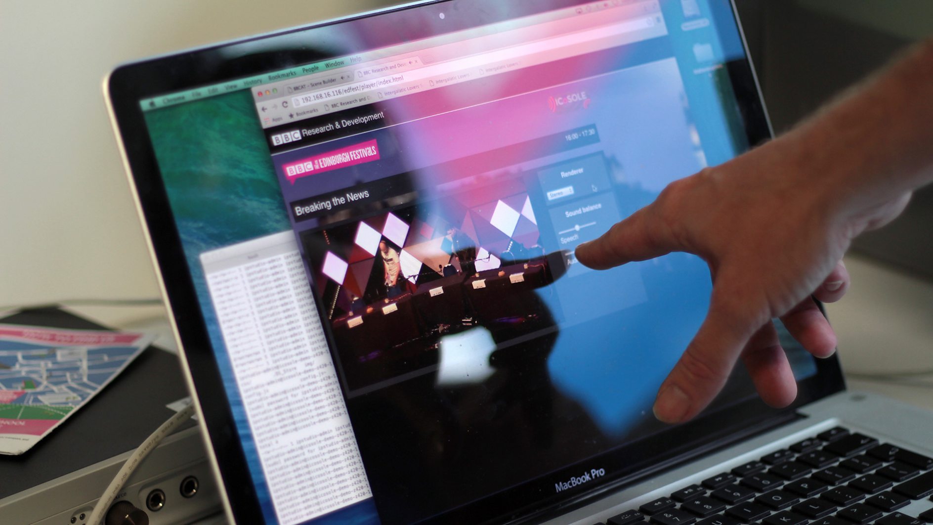 A hand pointing at a laptop running a BBC Research & Development broadcast tool at the Edinburgh Festivals.